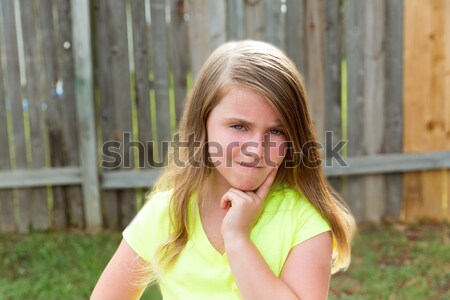 kid girl with disappoint expression finger thinking Stock photo © lunamarina
