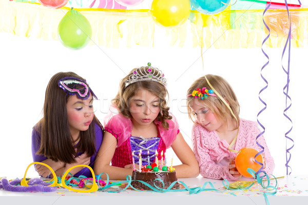 children happy girls blowing birthday party cake  Stock photo © lunamarina