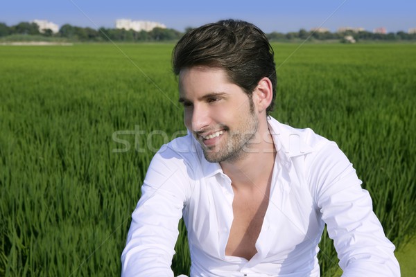 Young man outdoor happy in green meadow Stock photo © lunamarina