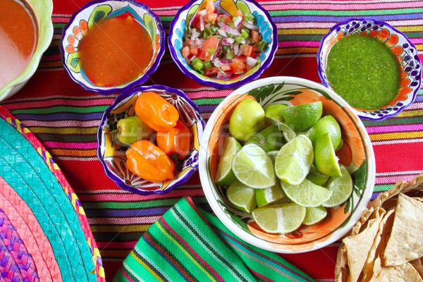 Mexican food varied chili sauces nachos lemon Stock photo © lunamarina