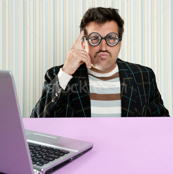 Nerd pensive man glasses silly expression laptop Stock photo © lunamarina