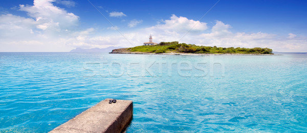 Aucanada Alcanada beach with pier island and lighthouse Stock photo © lunamarina