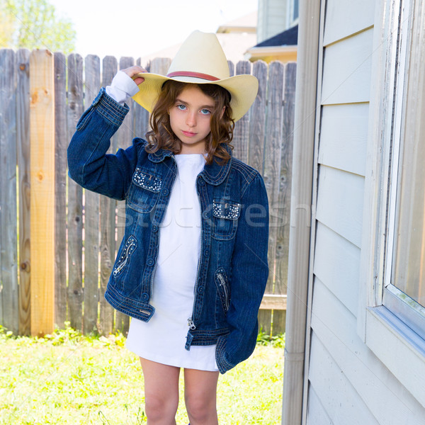 Little kid girl pretending to be a cowboy Stock photo © lunamarina