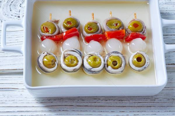 Olives anchovies and pickled onion pinchos Stock photo © lunamarina