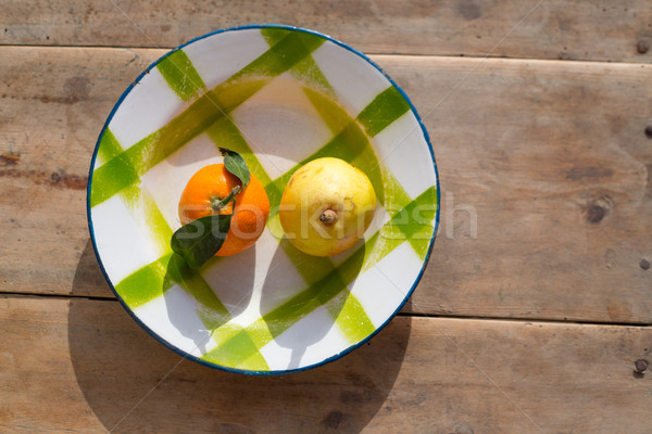 fruits tangerine and pear in vintage porcelain dish plate Stock photo © lunamarina