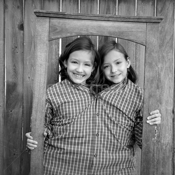 twin girls fancy dressed up pretending be siamese in frame Stock photo © lunamarina