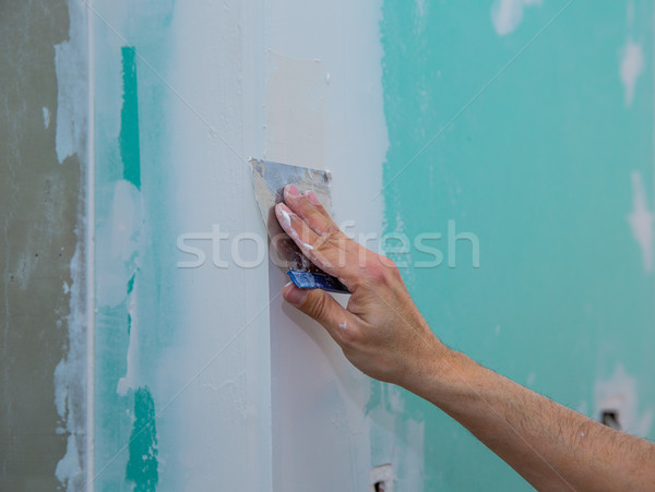 drywall hydrophobic plasterboard trowel plastering seam Stock photo © lunamarina
