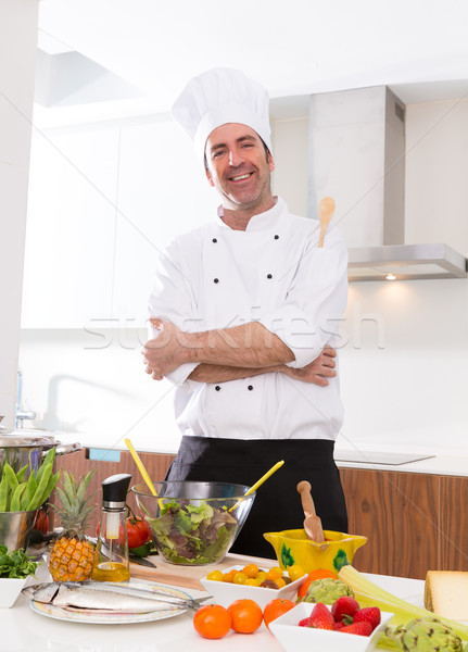 Chef male portrait on white countertop at kitchen Stock photo © lunamarina