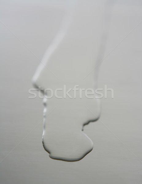 液體 油 金屬表面 不銹鋼 抽象 商業照片 © lunamarina