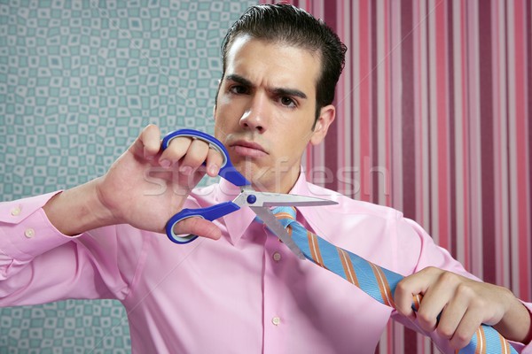 Businessman stressed with scissors cutting his tie Stock photo © lunamarina