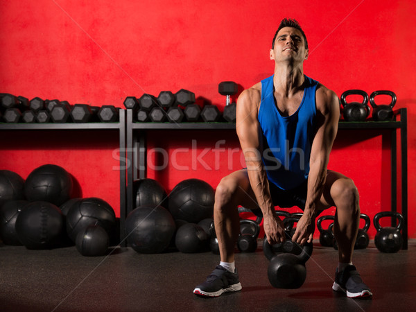 Kettlebell workout training man at gym Stock photo © lunamarina