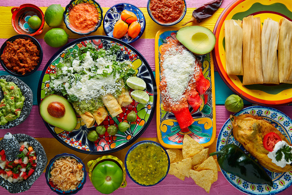Green and red enchiladas with mexican sauces Stock photo © lunamarina