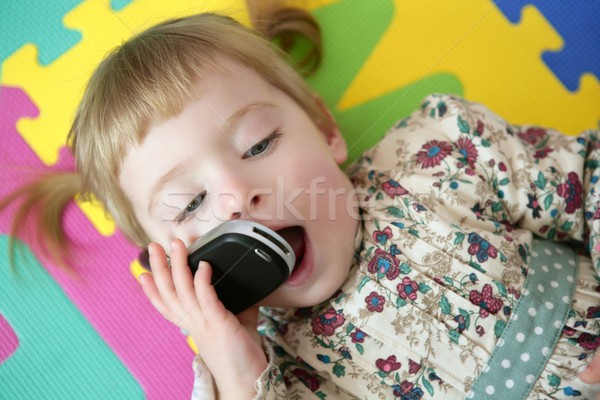 Funny toddler girl talking mobile cell phone Stock photo © lunamarina