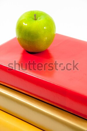 Green Apple with  Gold, Red and Yellow Books Stock photo © LynneAlbright