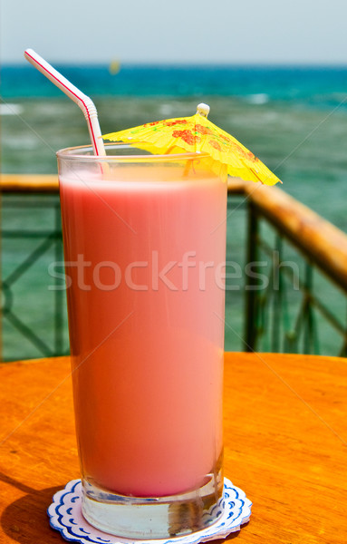 Glass of tasty juice with pipes. Stock photo © lypnyk2