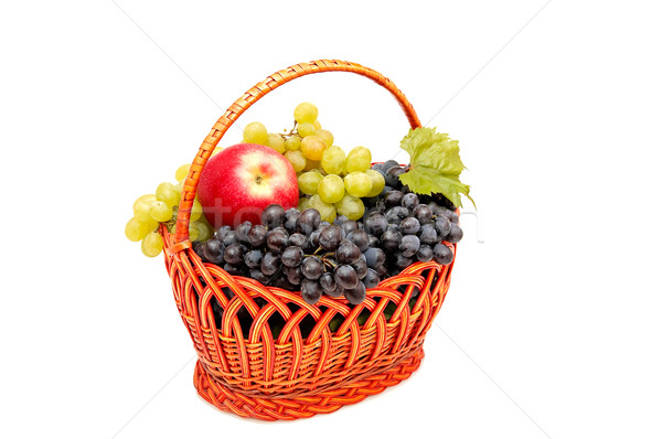 Bunches of grapes and apples in basket. Stock photo © lypnyk2
