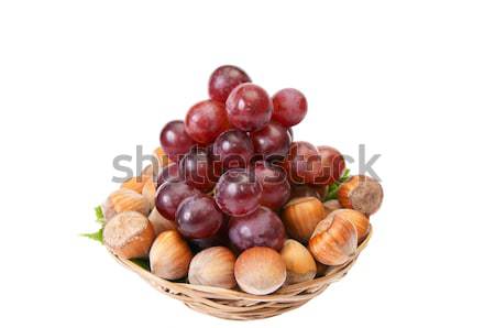 Tasty , ripe hazelnuts and grape isolated on a white background. Stock photo © lypnyk2