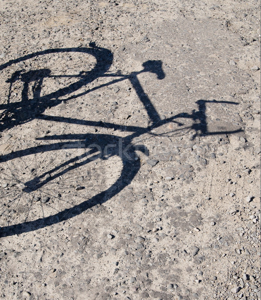 Stock photo: Abandoned bike and shadow from it.