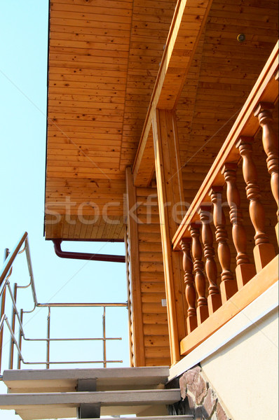 Wonderful wooden ceiling and spiral staircase in the modern hous Stock photo © lypnyk2