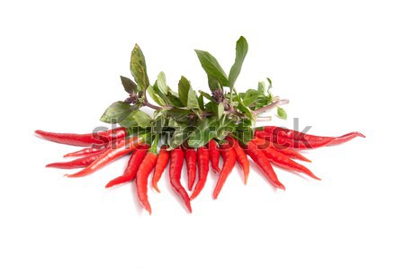 Stock photo: Green basil and ripe peppers on a white.