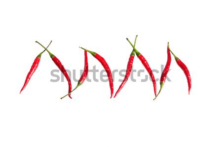 Stock photo: Fun ripe red peppers on a white.