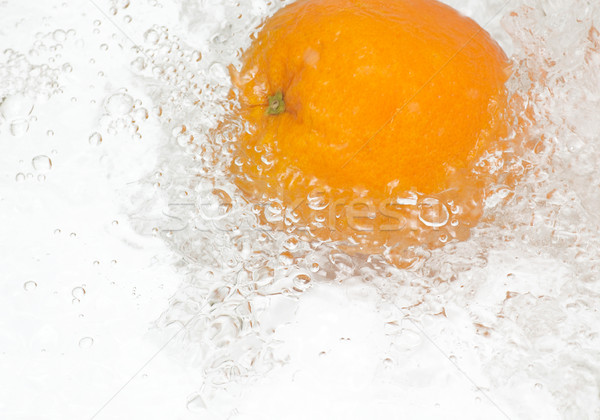 Fresh,tasty orange in streaming water. Stock photo © lypnyk2