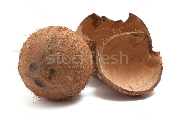 Stock photo: Whole and broken coconut on white background.