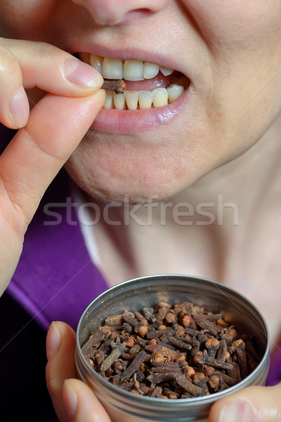 Woman chew dried clove spice Stock photo © mady70