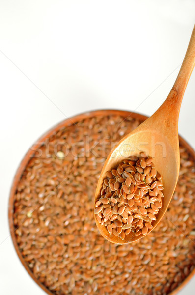 close up of flax seeds and wooden spoon Stock photo © mady70