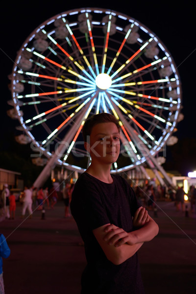 Adolescente menino parque de diversões noite tempo família Foto stock © mady70