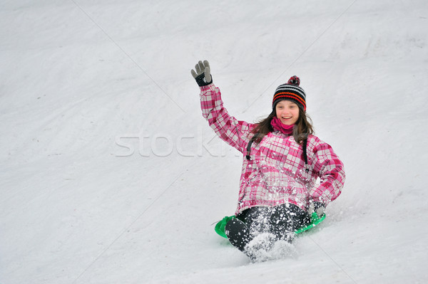 girl sliding in the snow Stock photo © mady70