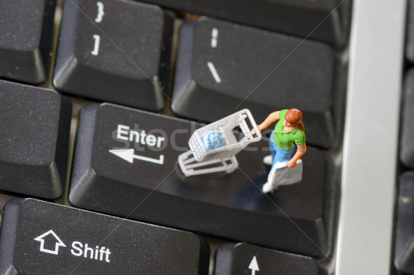 Online shopping with shopper on a keyboard Stock photo © mady70
