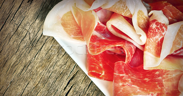 Prosciutto szeletek régi fa sonka makró vízszintes Stock fotó © mady70