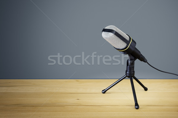 Stock photo: typical microphone on a wooden desk