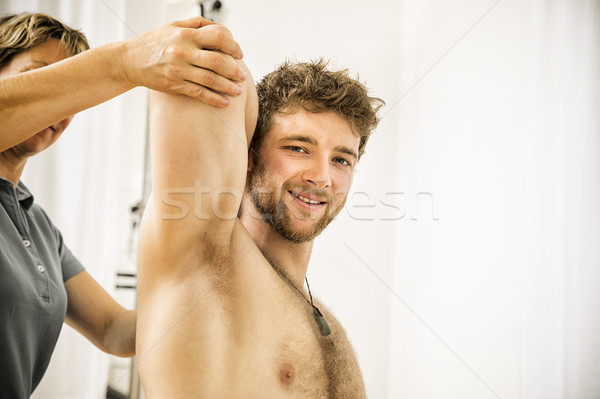 Jeune homme thérapie image homme santé massage [[stock_photo]] © magann