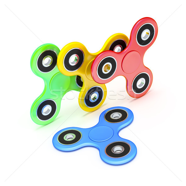 four fidget spinner in different colors Stock photo © magann