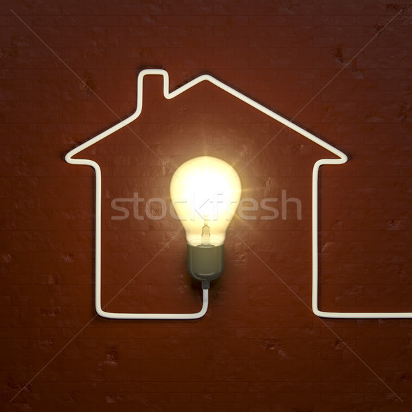 Stock photo: a light bulb building a house with the cable