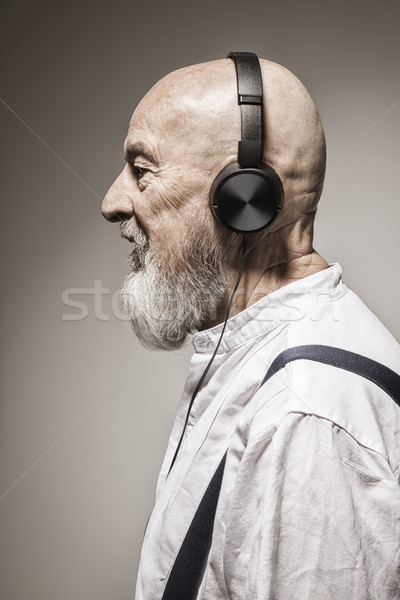 Idoso careca cabeça homem fones de ouvido imagem Foto stock © magann