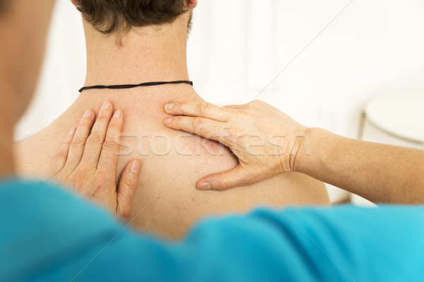 young man at the physio therapy with pain Stock photo © magann