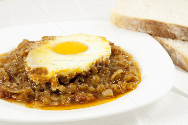 Stew with baked onion, egg and meat Stock photo © magraphics