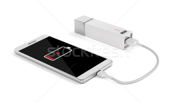 Smartphone charging with external battery Stock photo © magraphics