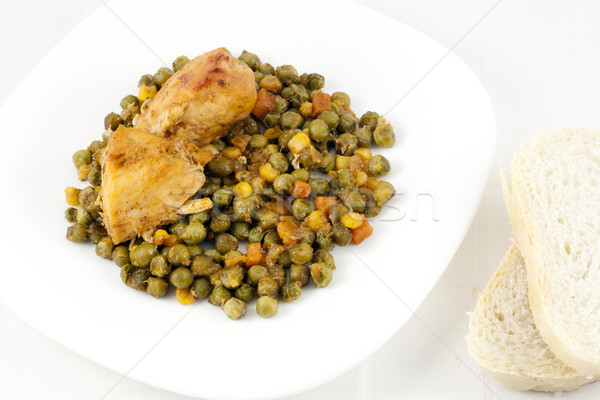 Chicken with peas, carrots, corns and bread Stock photo © magraphics