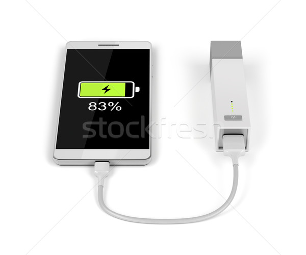 Smartphone charging with power bank Stock photo © magraphics