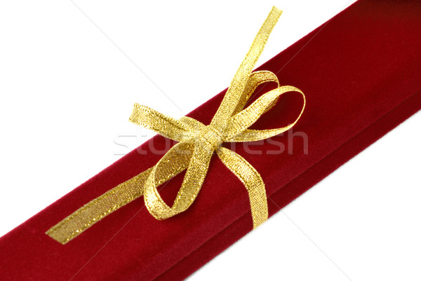 Stock photo: Red jewelry box with gold ribbon