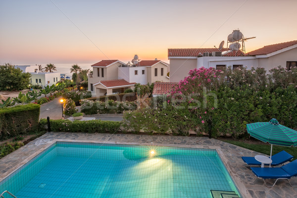 Vacanze tramonto luce piscina fiori mare Foto d'archivio © mahout
