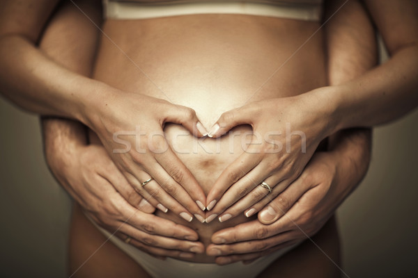 Beautiful young pregnant woman's belly Stock photo © majdansky