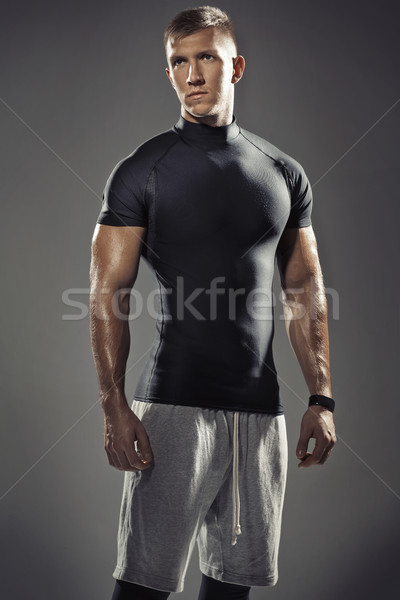 Portrait of young muscular trainer Stock photo © majdansky