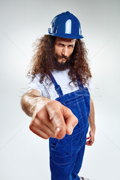 Portrait of a skinny craftsman wearing blue uniform Stock photo © majdansky