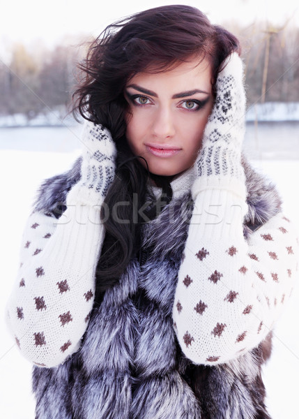 beauty in a fur vest Stock photo © mallivan