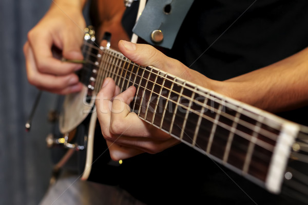 electric guitar close-up with fingers playing it Stock photo © manaemedia